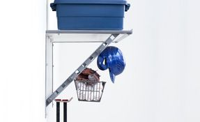 a blue box is sitting on top of a shelf with a baseball equipment .