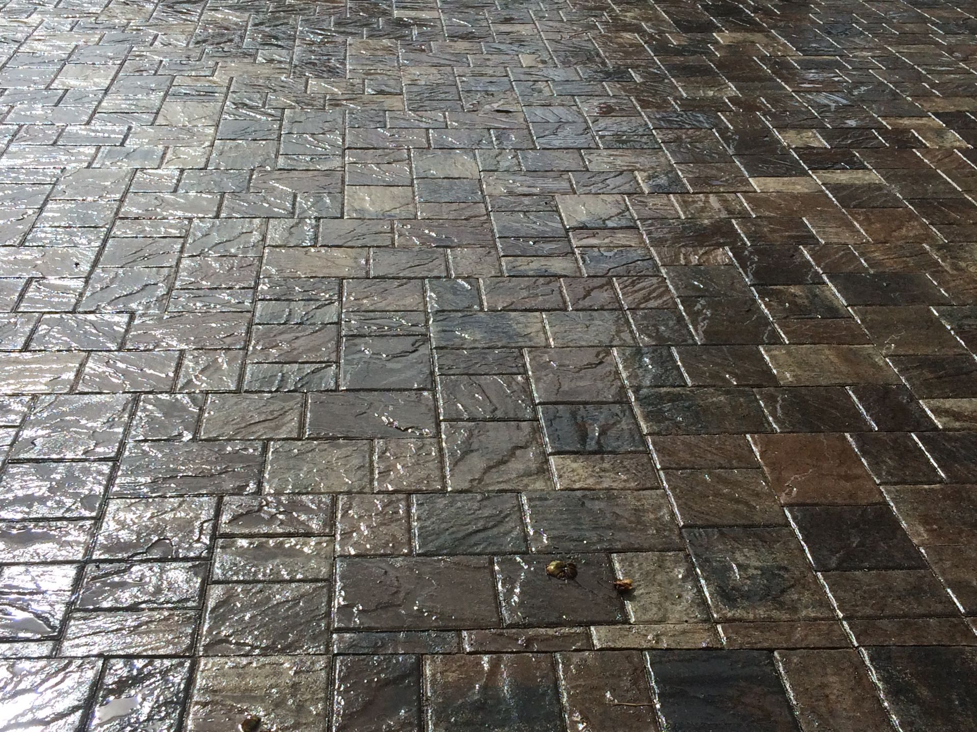 A close up of a brick floor with a lot of bricks on it.