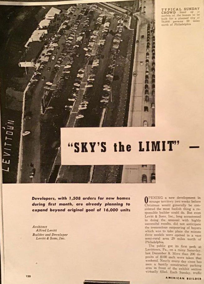 Aerial view of a busy parking lot beside a building, with the caption “SKY’S THE LIMIT.”
