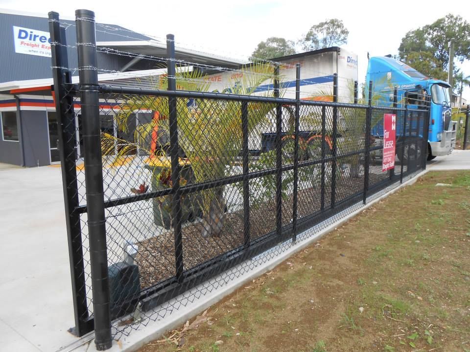 Black Chain-link Fence With a Sliding Gate — The Fence Place in Port Kawana, QLD