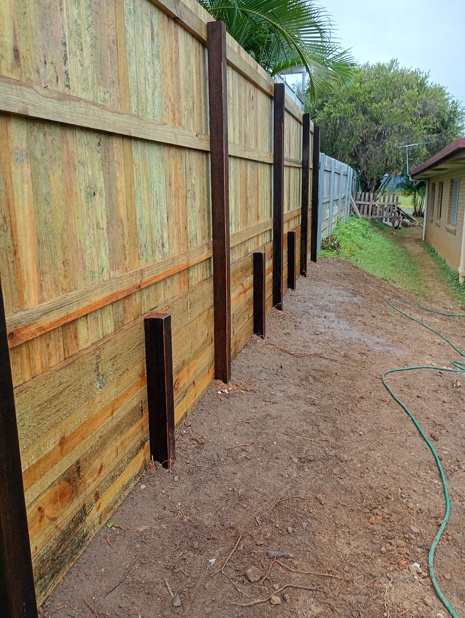 Wooden Fence Under Construction With Exposed Posts — The Fence Place in Kawana, QLD