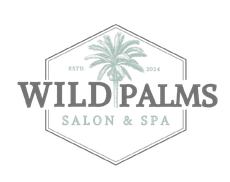 A logo for wild palms salon and spa with a palm tree on it.
