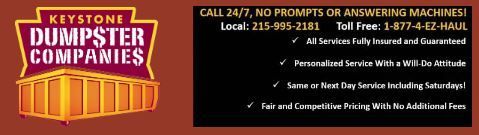 A sign for keystone dumpster companies says call 24/7 no prompts or answering machines