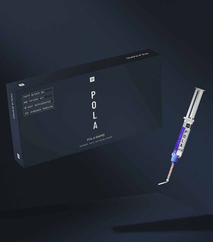 A box and a syringe are sitting on a table.
