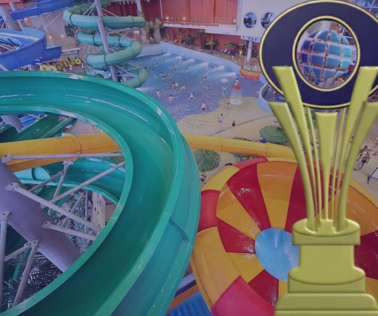 Water park with slides and award trophy in the foreground.