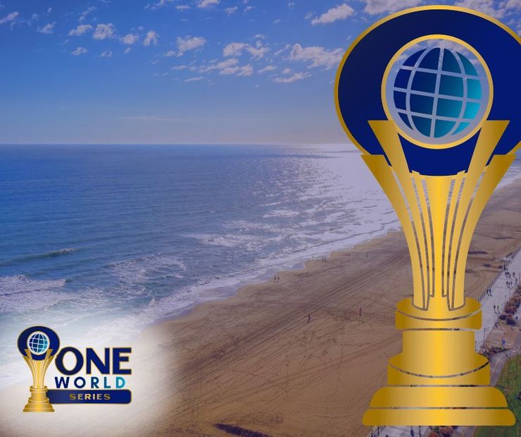 Gold trophy with globe over a beach and ocean view.