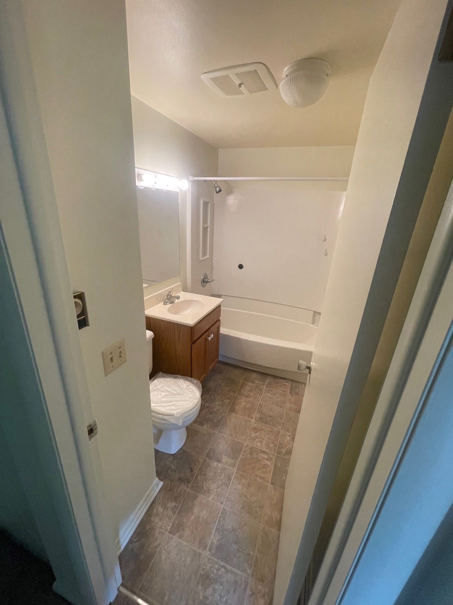 bathroom with vanity and shower
