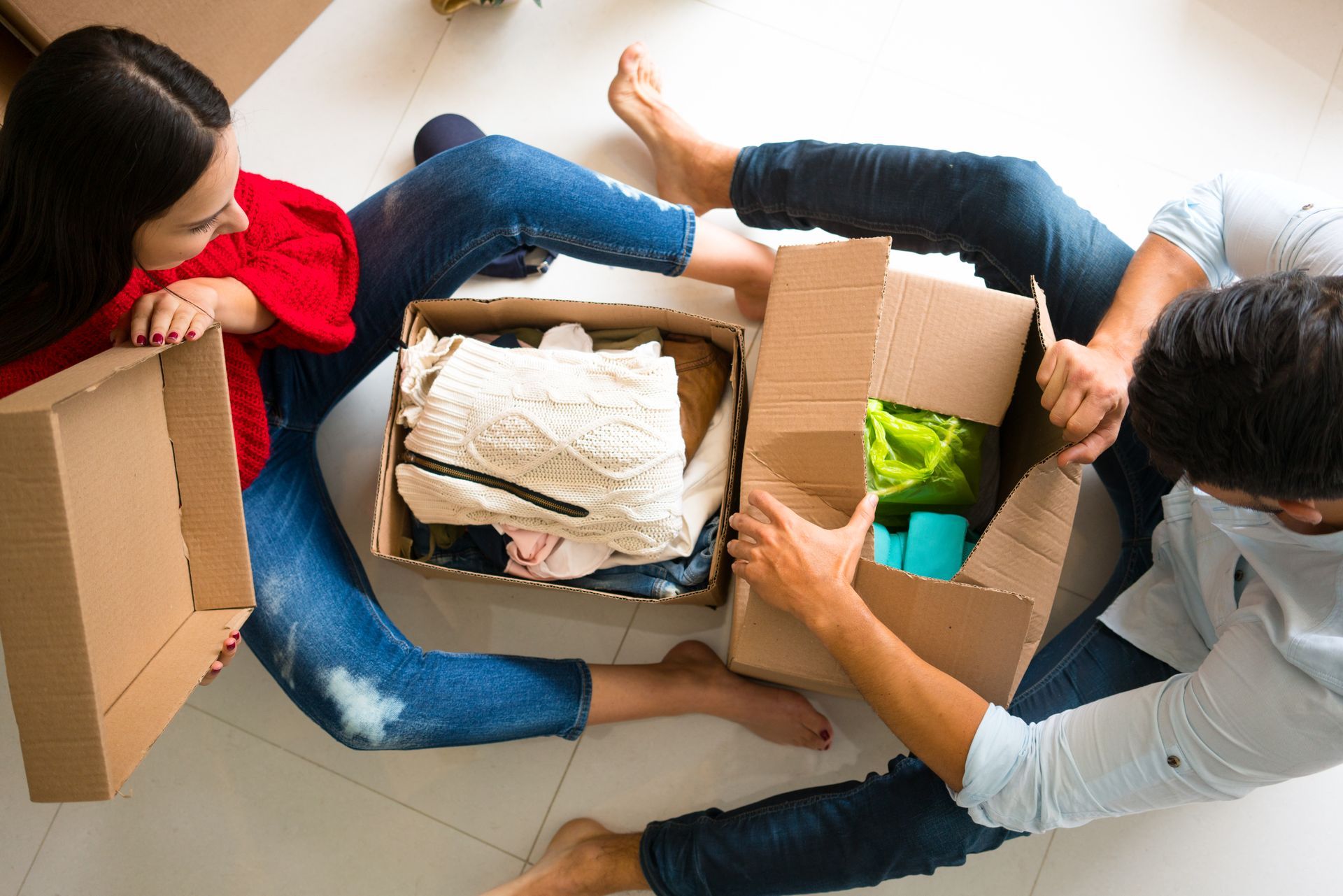 couple unpacking boxes