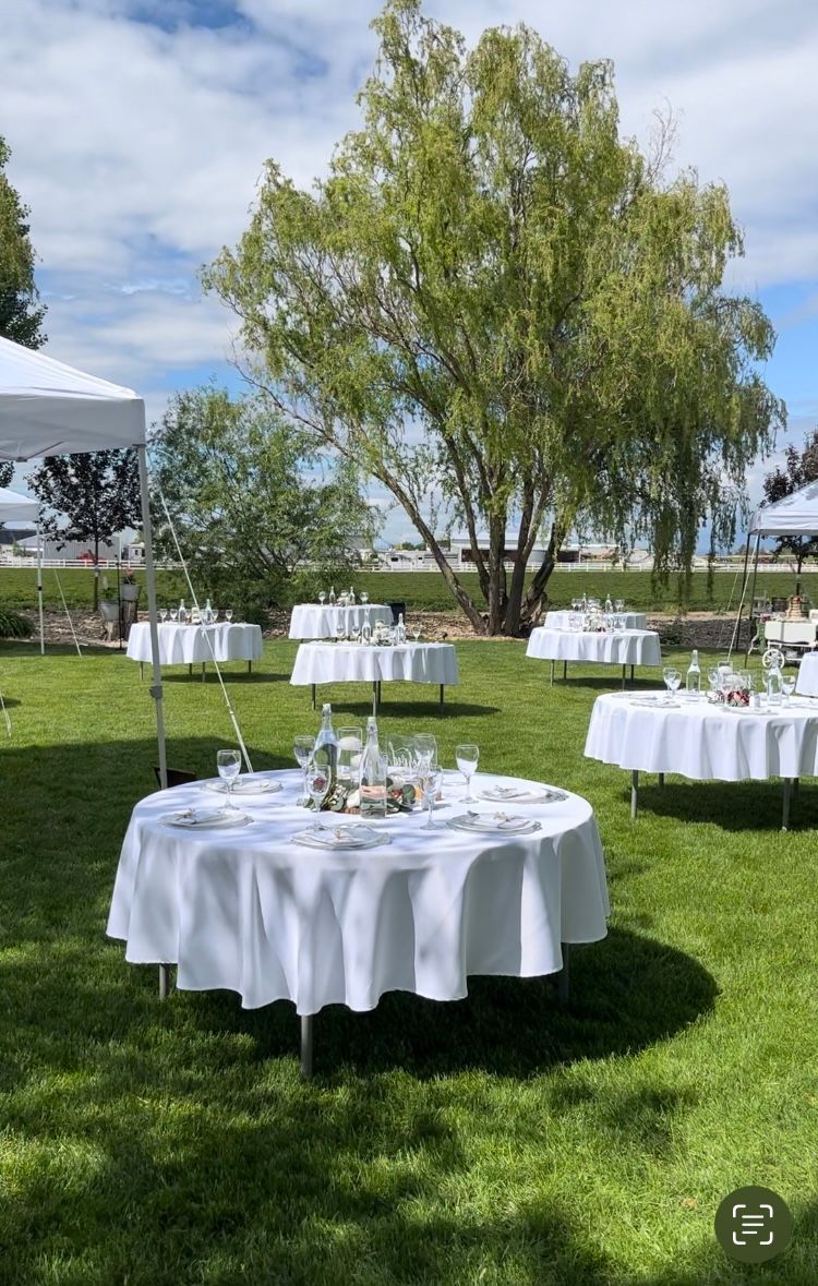 Our 5ft round tables with white 1/2 drop 90in covers