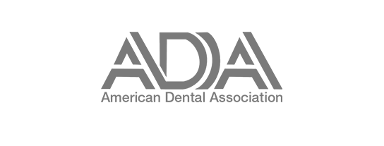 The logo for the american dental association is black and white.