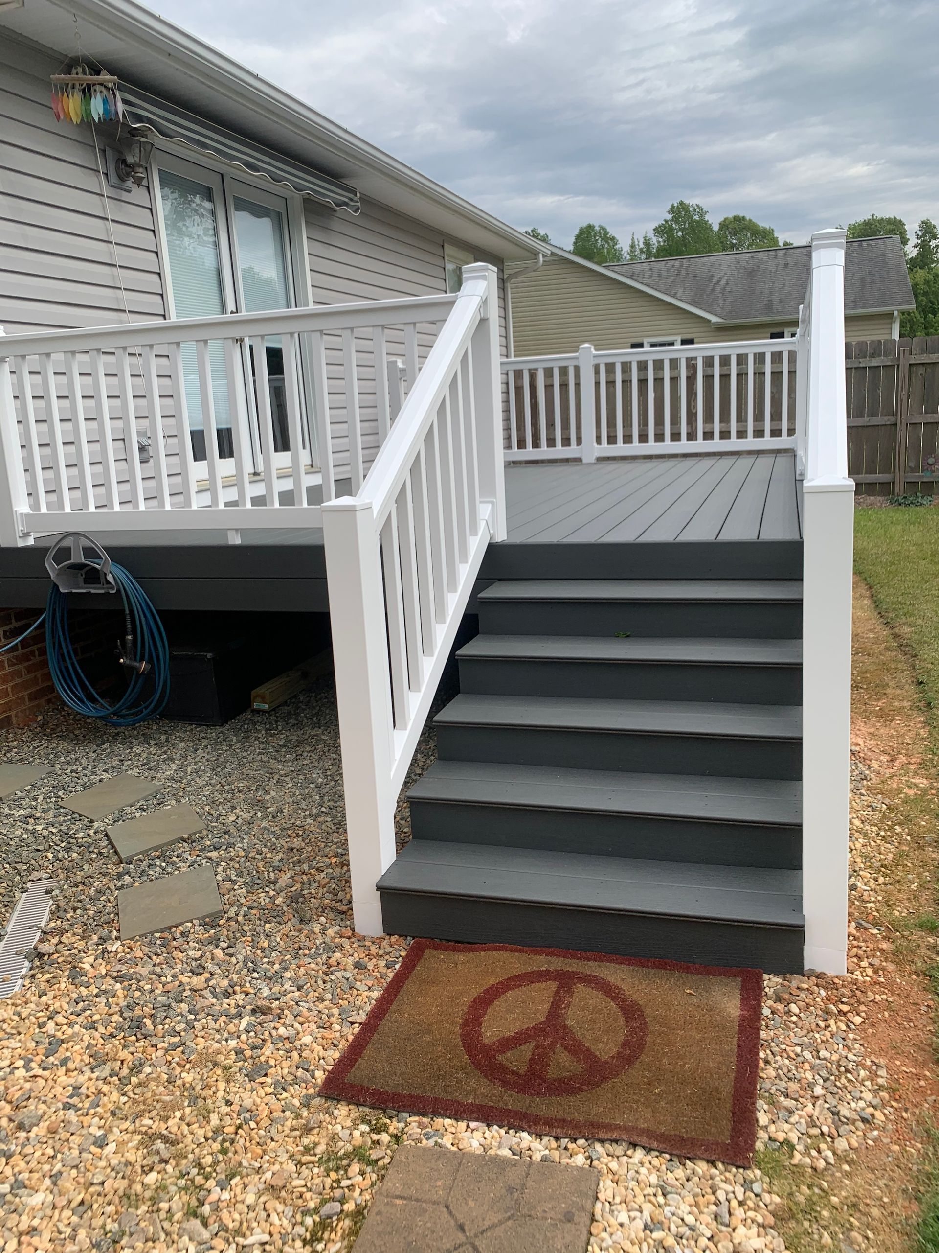 A deck with stairs and a peace sign on it