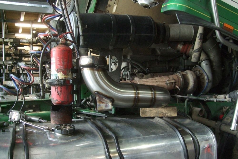 A Fire Extinguisher is Attached to the Side of a Tractor Engine — Bob Parkes Automotive in Hyde Park, QLD