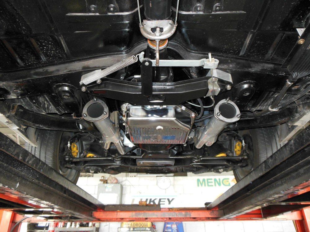 The Underside of a Car is Shown in a Garage — Bob Parkes Automotive in Hyde Park, QLD