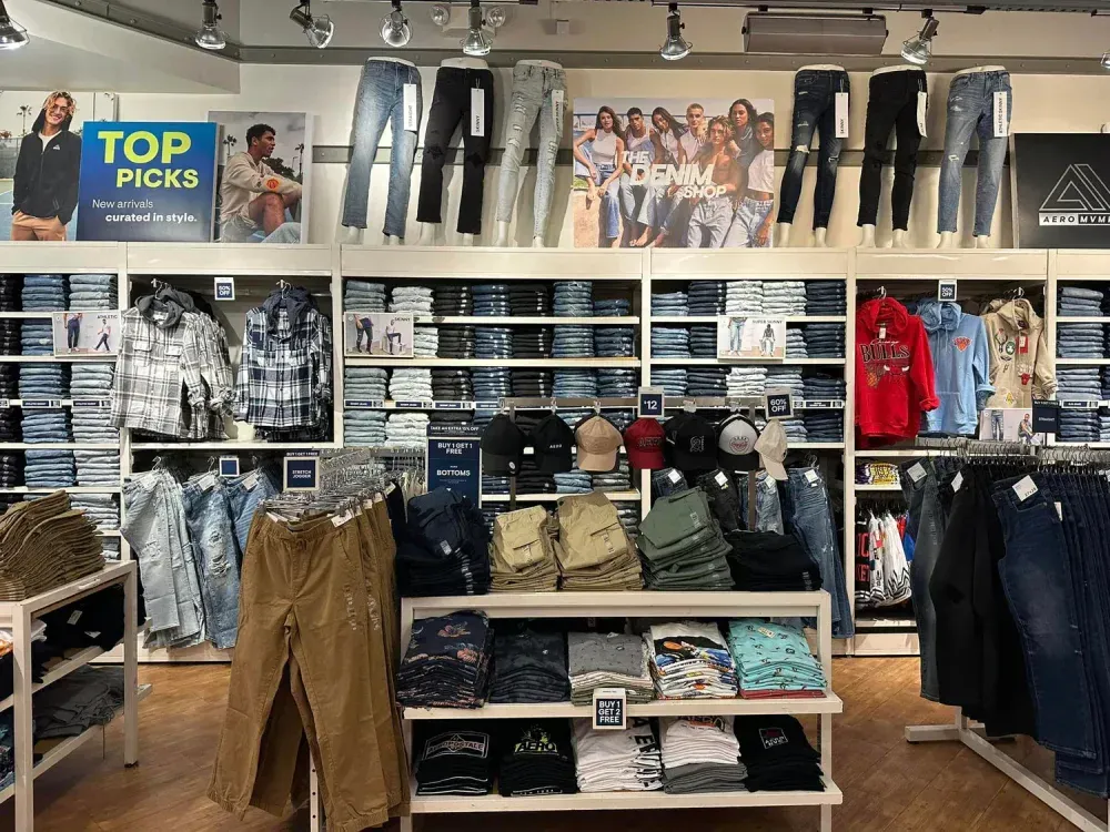 Aeropostale store filled with lots of clothing and a sign that says top picks