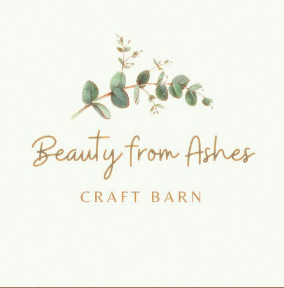 Logo with watercolor leaves and the words “Beauty From Ashes Craft Barn” on a light background