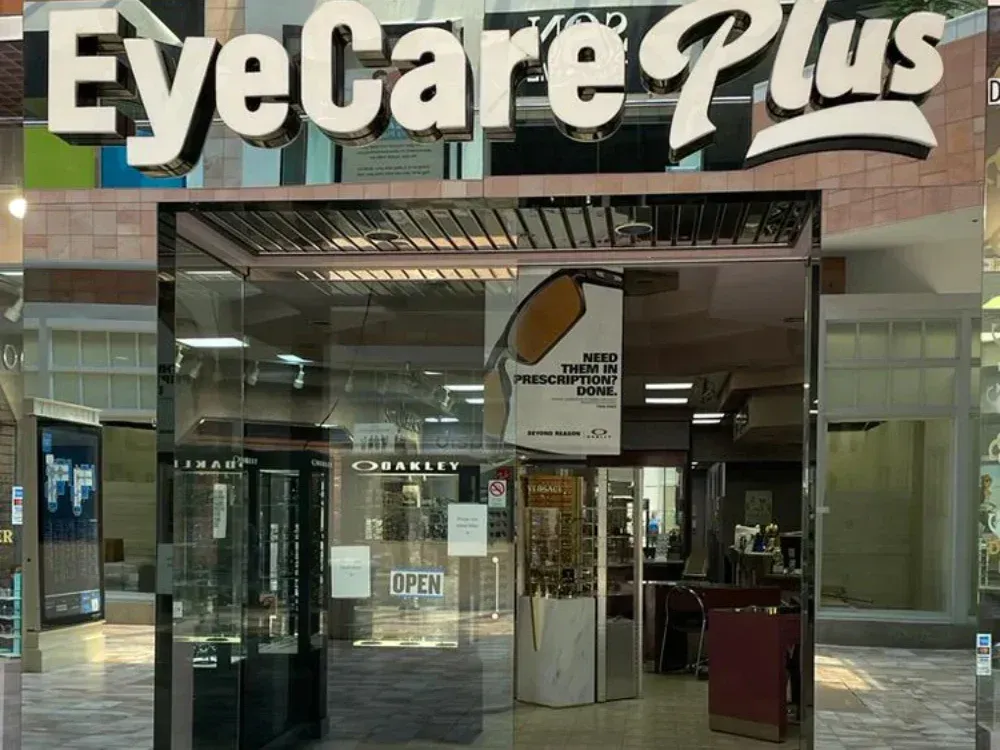 The front of an eye care plus store in a mall