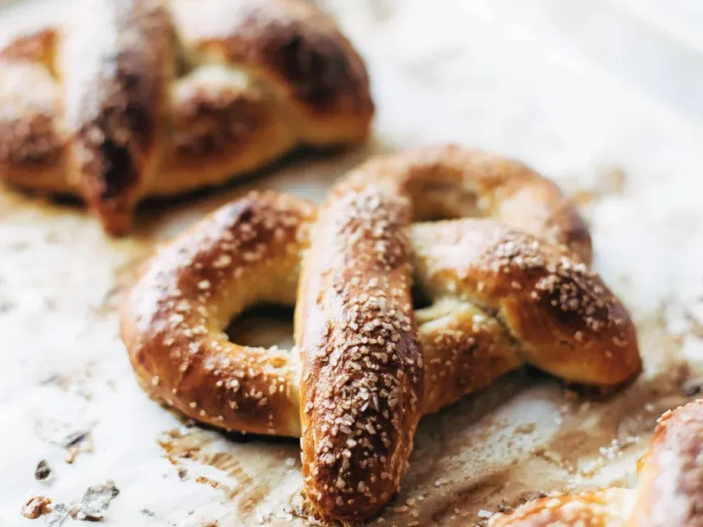 A close up of two pretzels on a table.