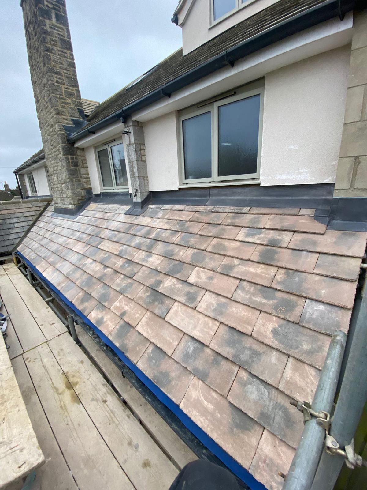 a house with a roof that has shingles on it