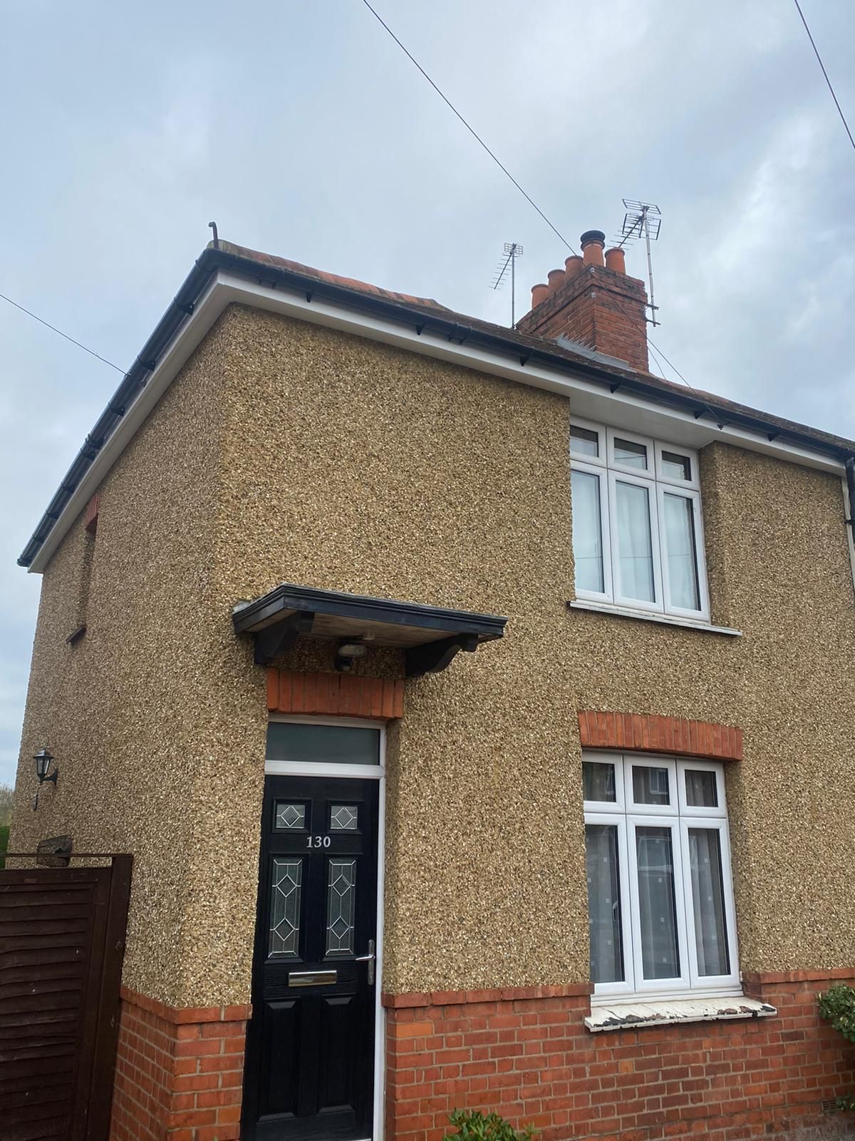 a house with the number 130 on the front door