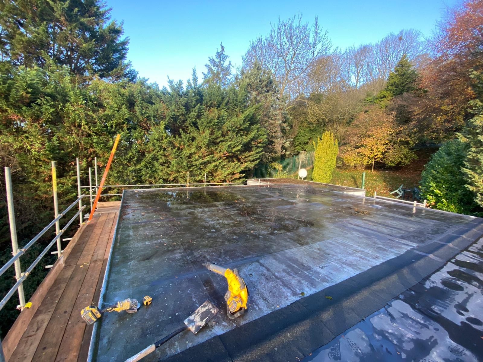 a roof with a scaffolding and tools on it