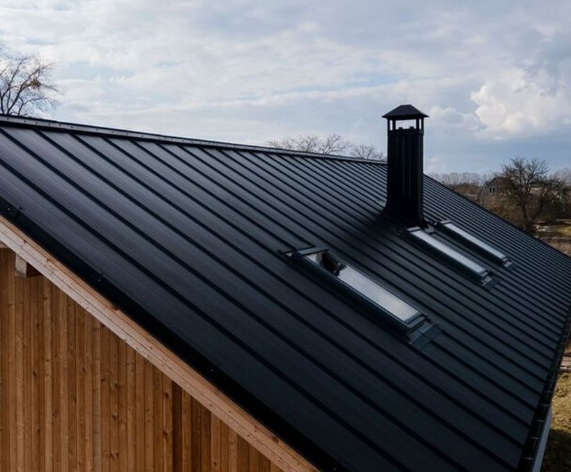 The roof of a house with a roof vent
