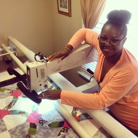 Woman Using Longarm Machine Quilting