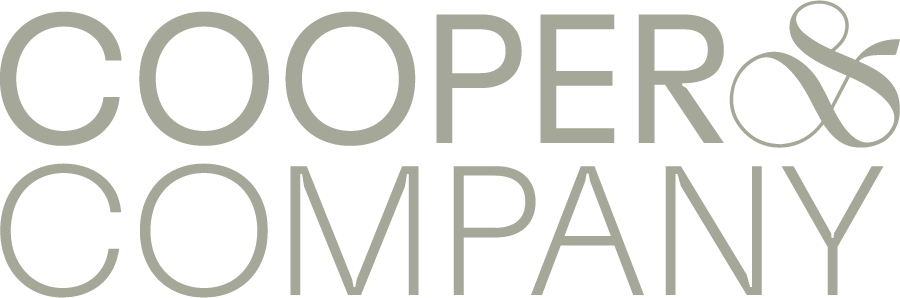 Cooper & Company logo in light gray text with a blue ampersand on a white background