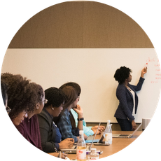 Woman at blackboard facilitating