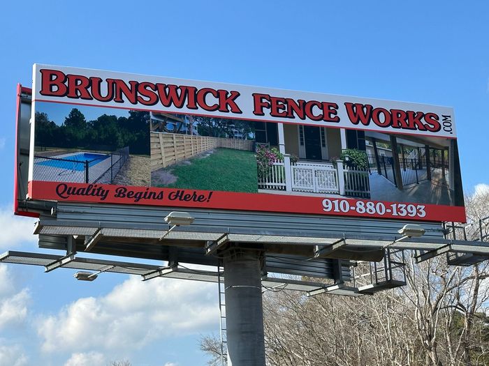 A billboard for brunswick fence works.