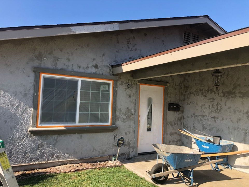 A ladder is sitting in front of a house under construction.