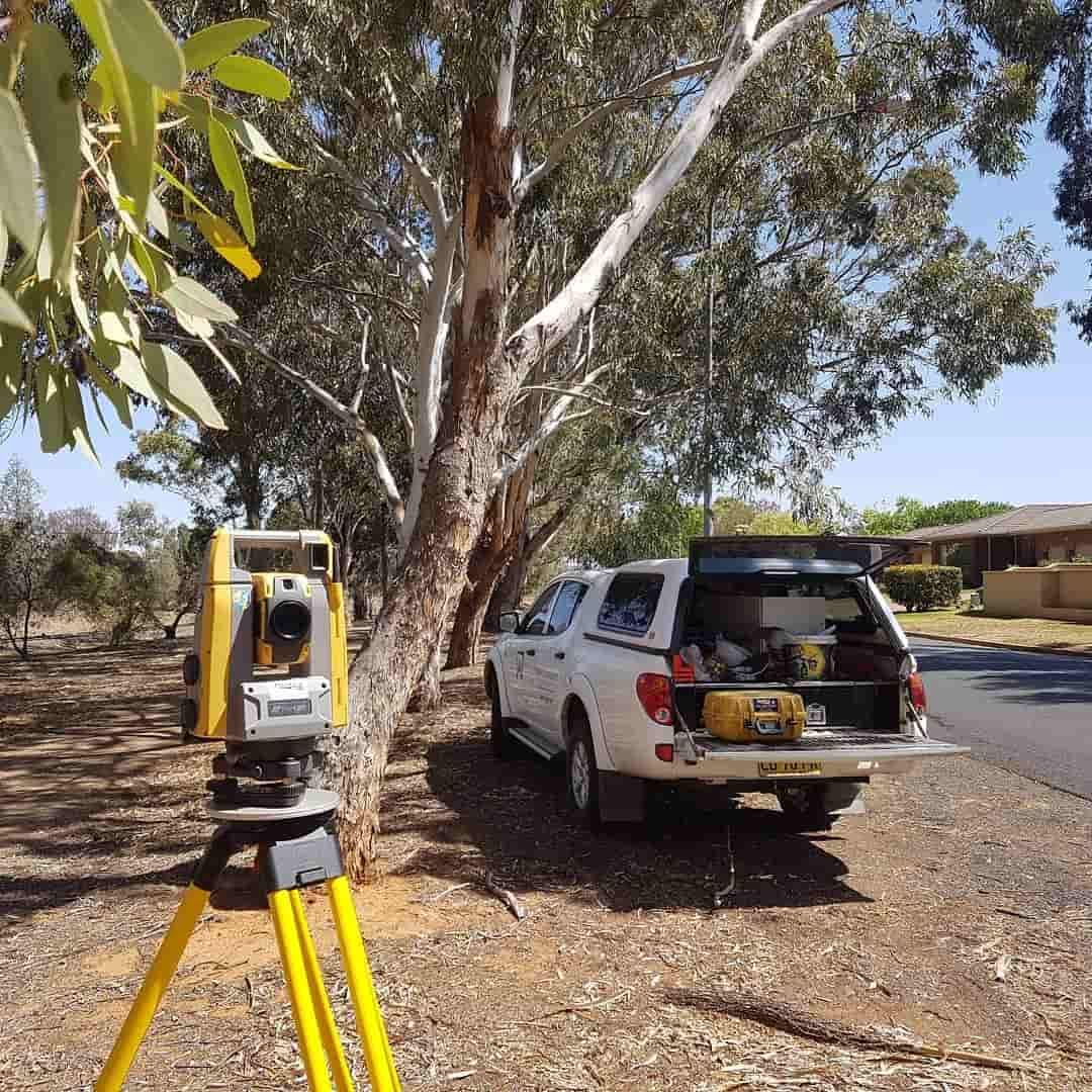 A Truck Is Parked Next To A Tree And A Theodolite — Western Survey Pty Ltd In Dubbo, NSW