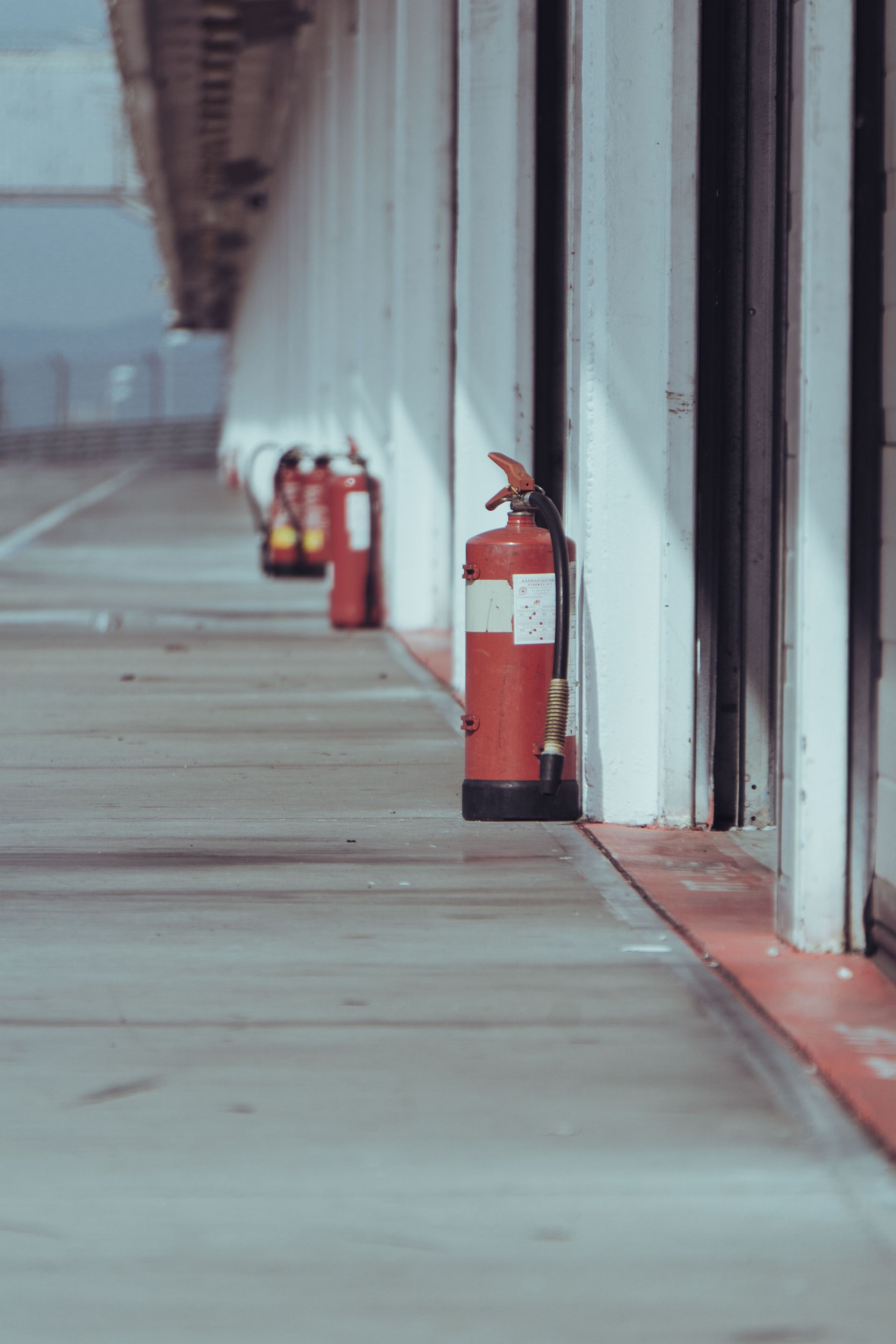 ABC and CO2 fire extinguishers installed along factory production line