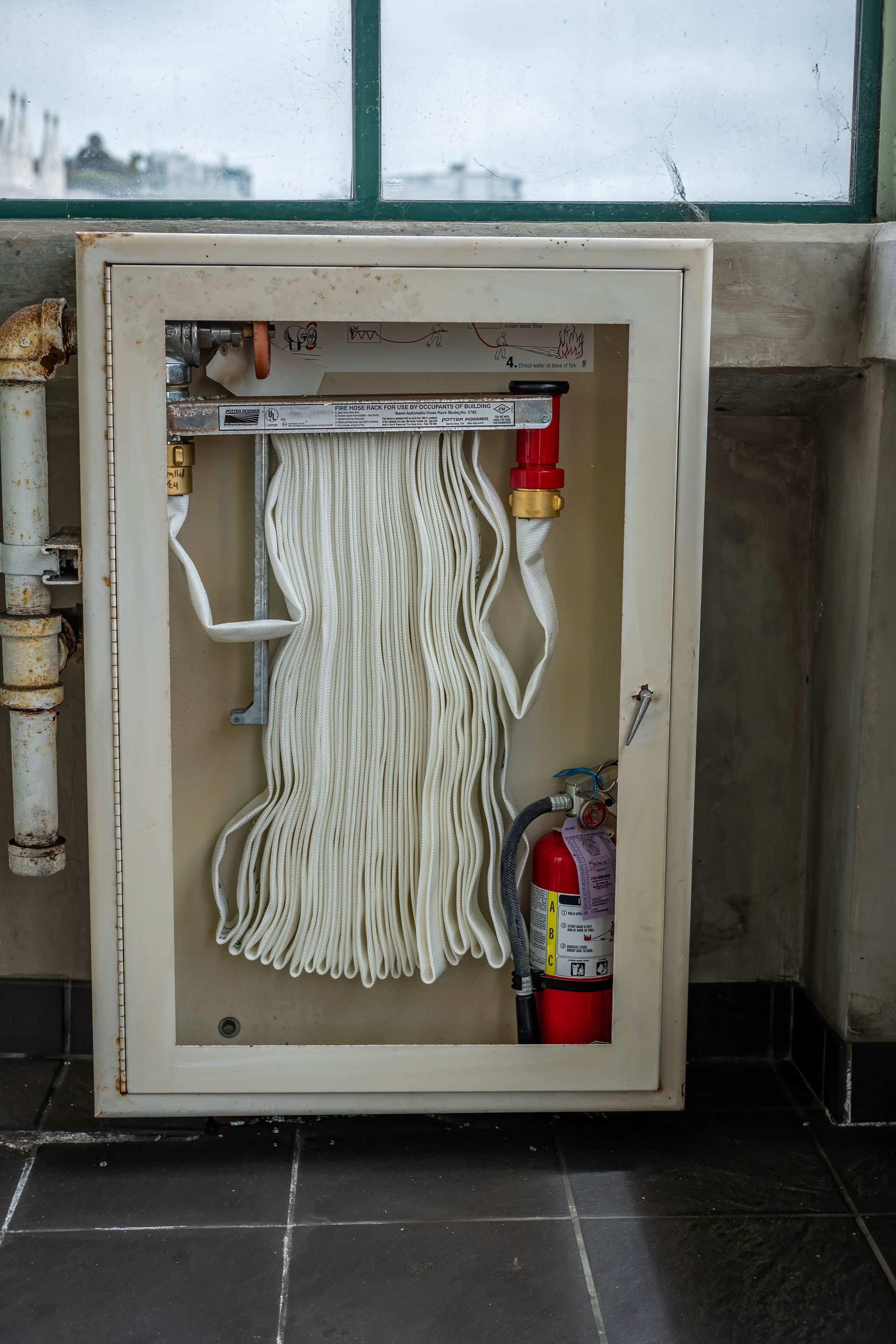 Mounted Class K fire extinguisher in commercial kitchen cabinet – Bossier City
