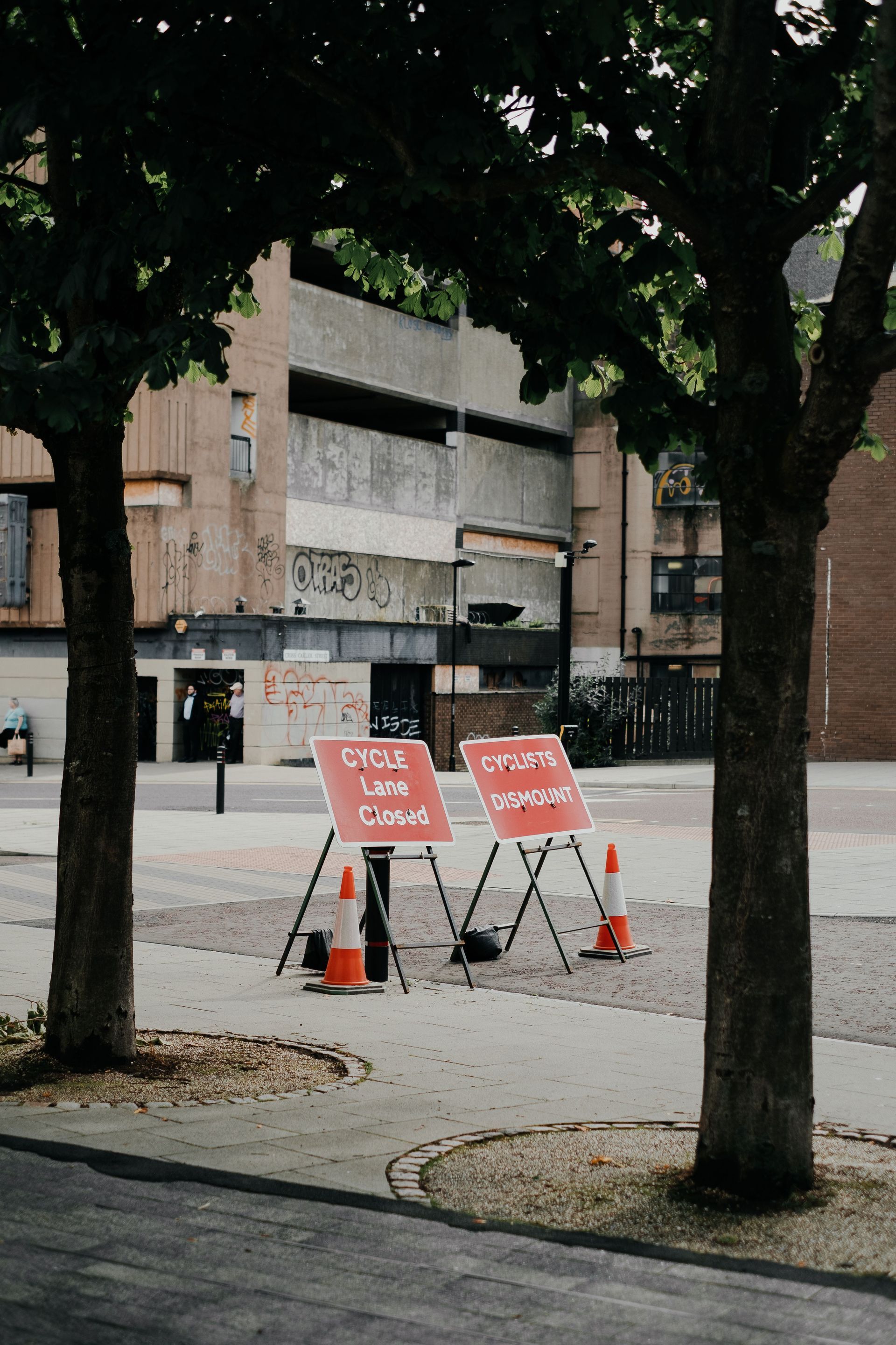 High-visibility safety signage and traffic cones at construction site