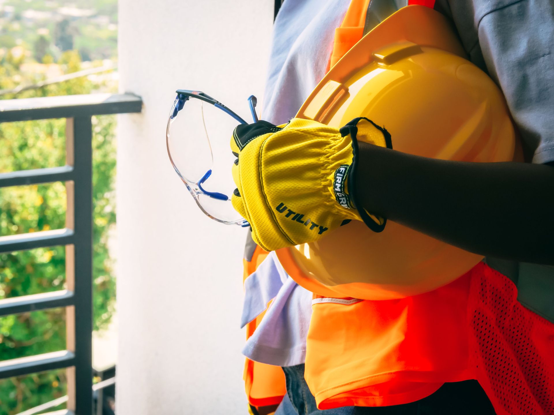 PPE station with safety glasses, earmuffs, and protective gloves