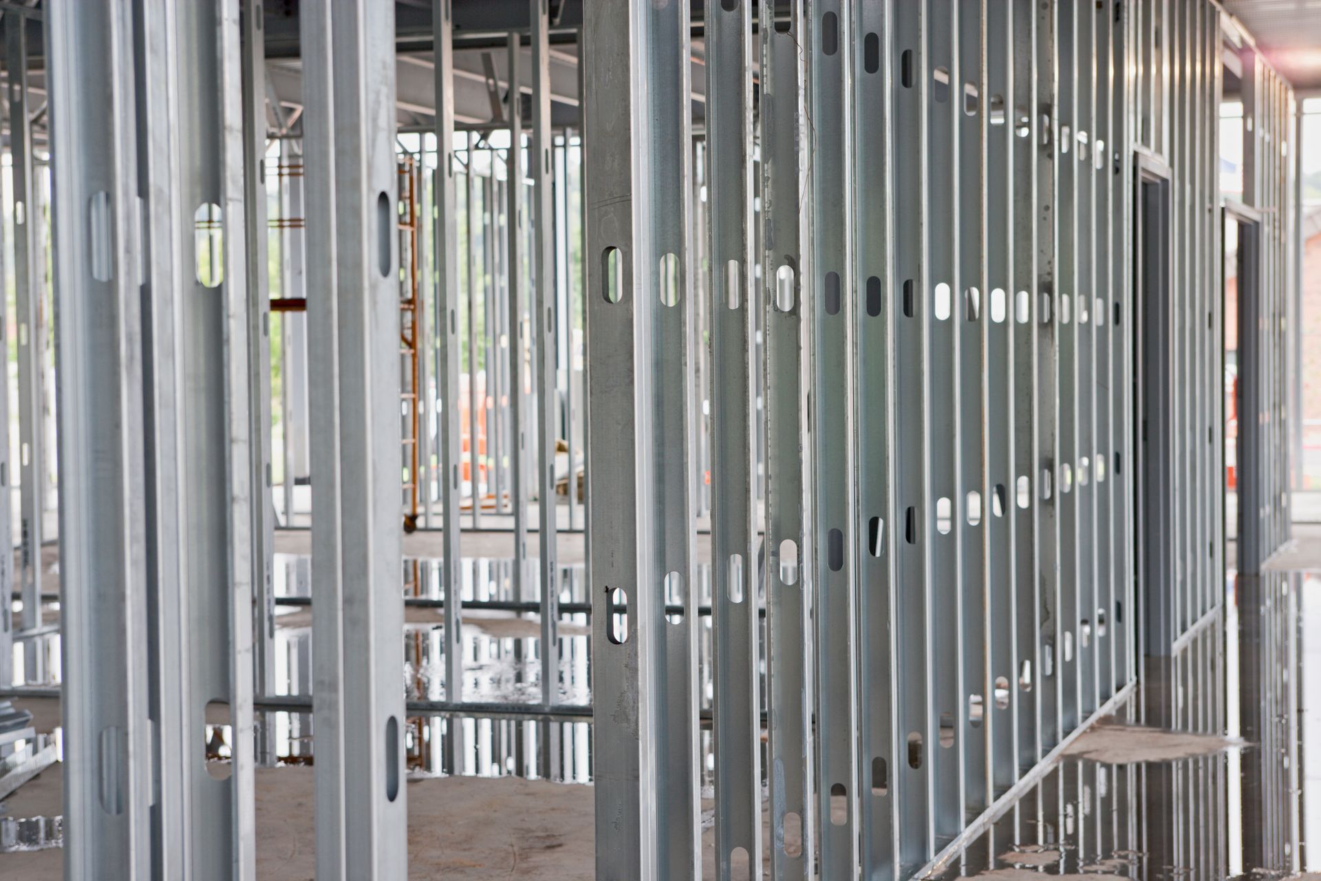 Foundation metal beam bracing solutions with steel beams at the construction site.