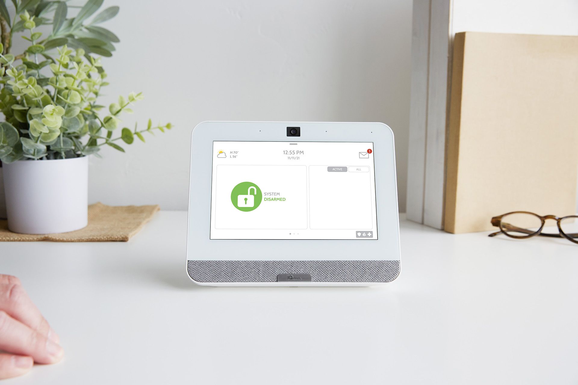 A tablet is hanging on a wooden wall.