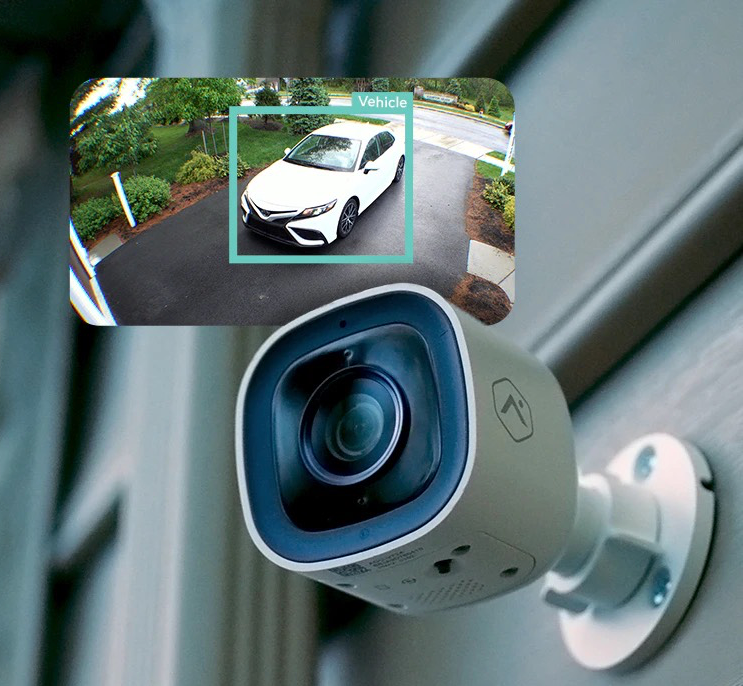 A security camera with a picture of a car on it