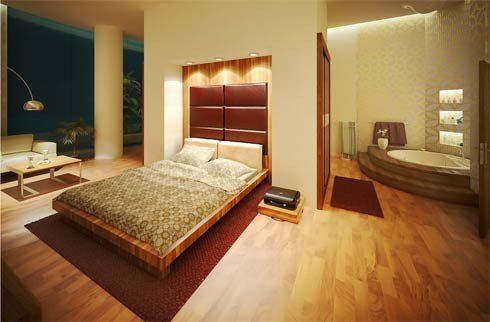 A bedroom with a large bed and a bathtub