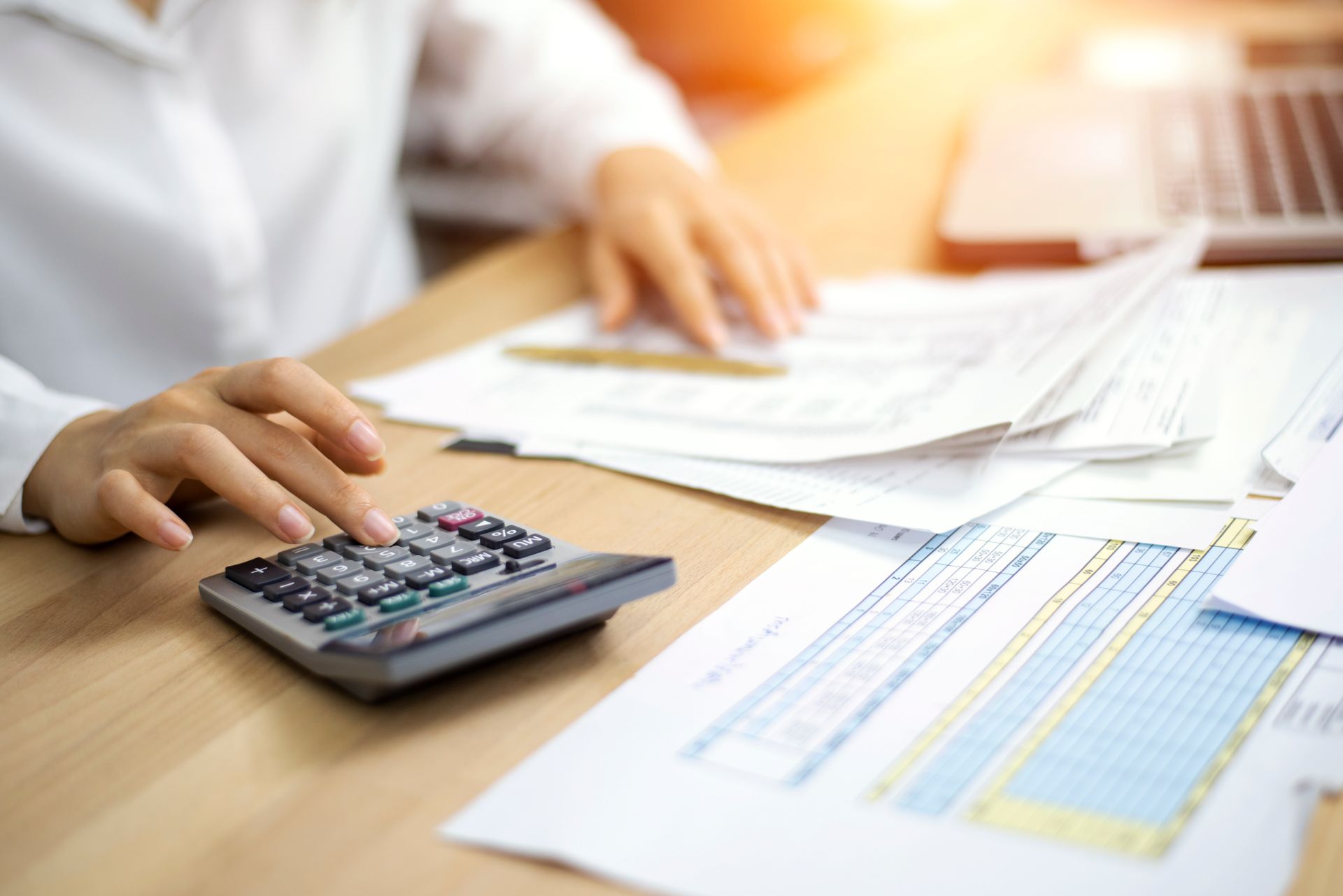 Papers and Calculator — Boulder, CO — Small Business Accountants of Colorado