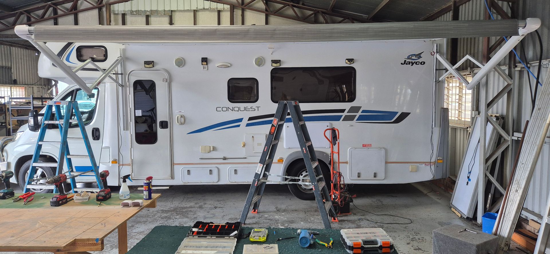 A Caravan with A Retractable Awning Extended — Revive Caravan Repairs in Kippa-Ring, QLD