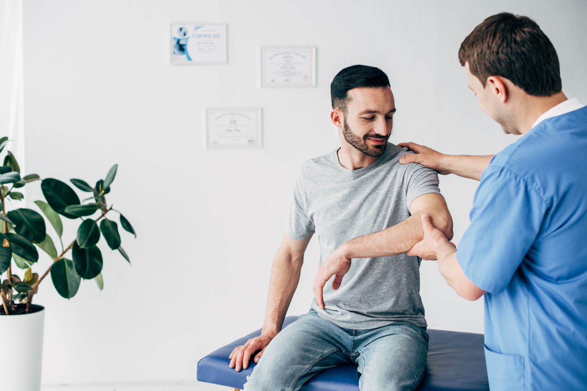 Physical therapist guiding a patient through a mobility exercise