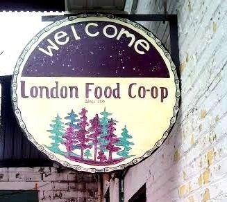 Painting of some trees in purple and green/turquoise with the words: Welcome London Food Coop printed above.
