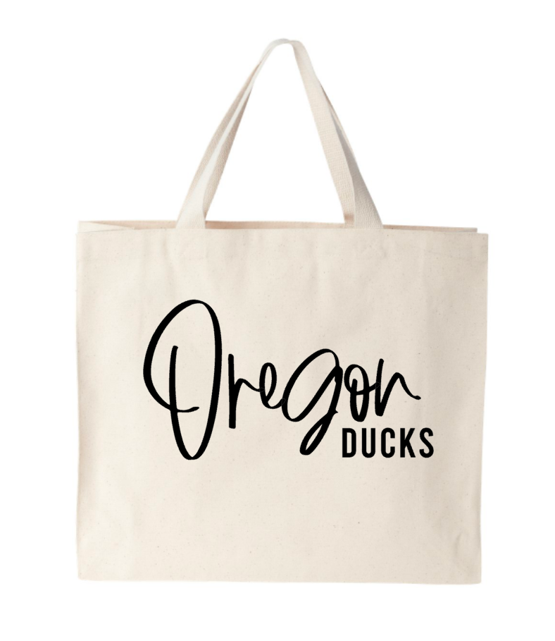 A white tote bag that says oregon ducks on it