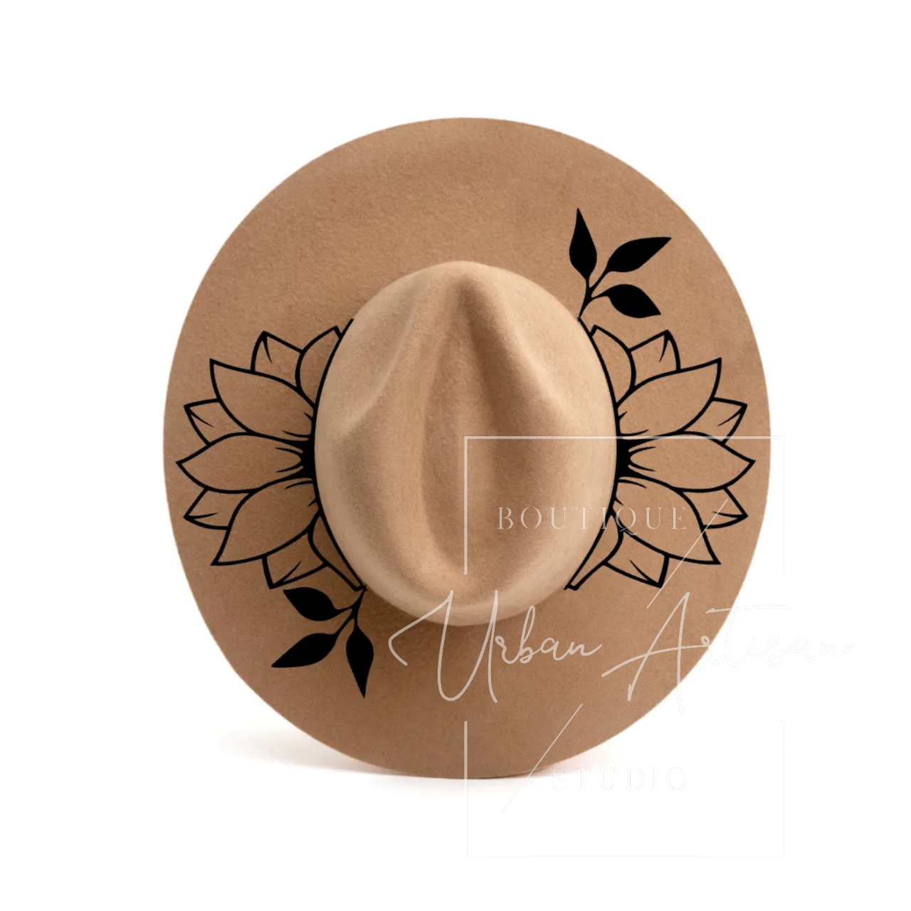 A tan hat with black flowers and leaves on it