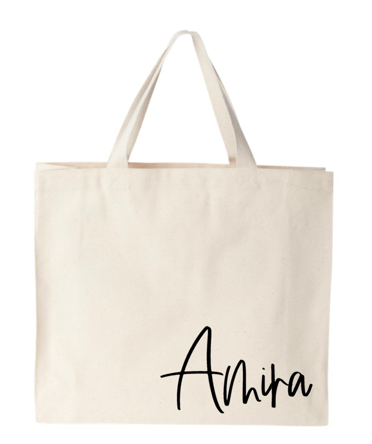 A white tote bag with the name akira on it