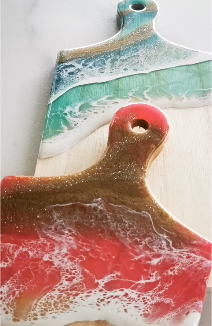 A close up of a marble cutting board with a logo in the background.