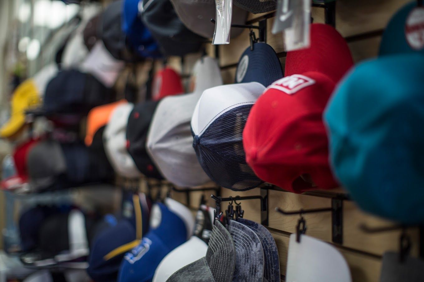 Hats Hanging on a Rack — Tempe, AZ — Big Stitch Embroidery