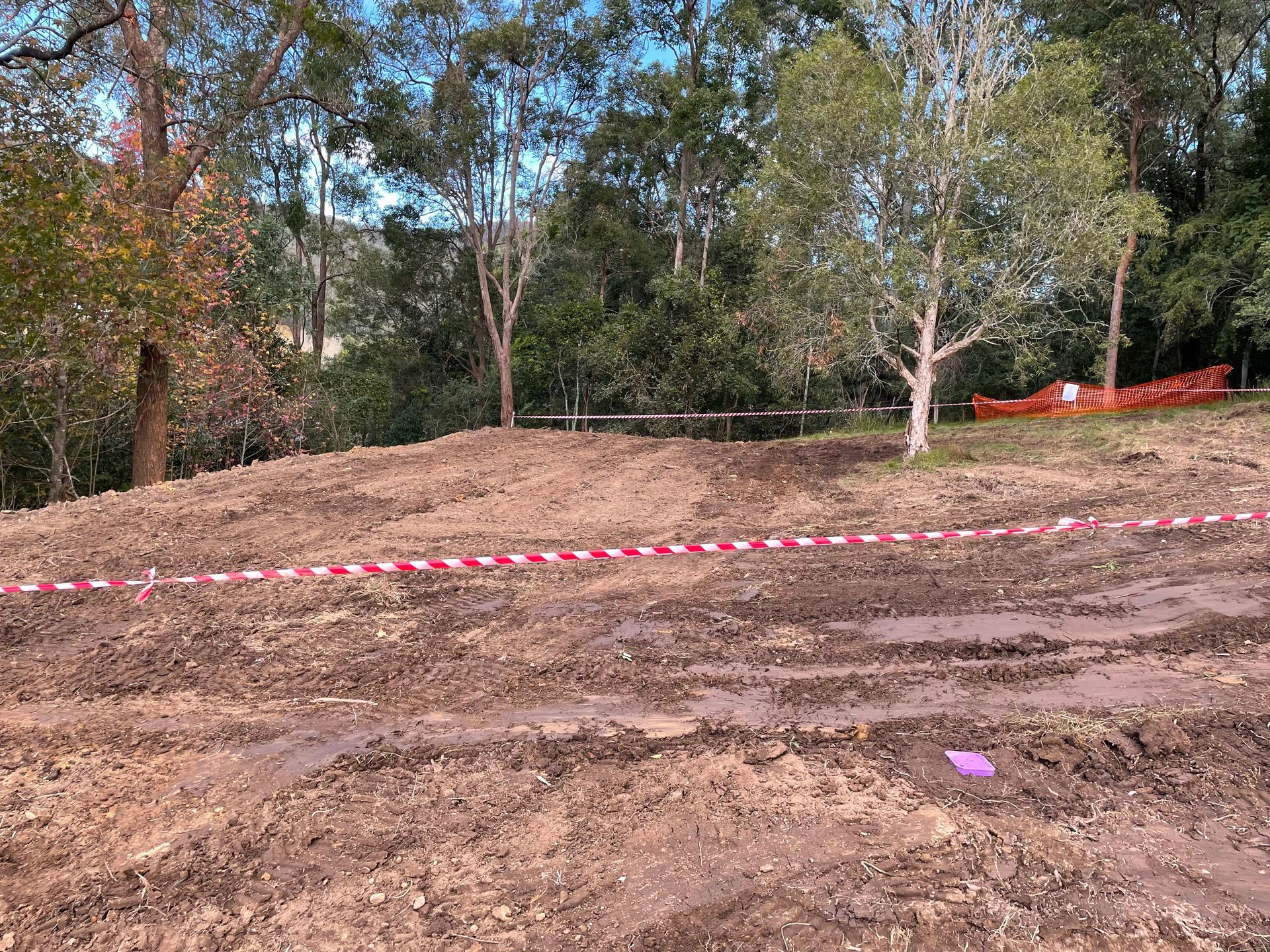 Site preparation for underground septic system installation in a rural, wooded area by a trusted septic system provider.