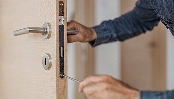 Locksmith Fixing Door Lock — Grants Pass, OR — Valley Lock & Key Locksmith Fixing Door Lock — Grants Pass, OR — Valley Lock & Key
